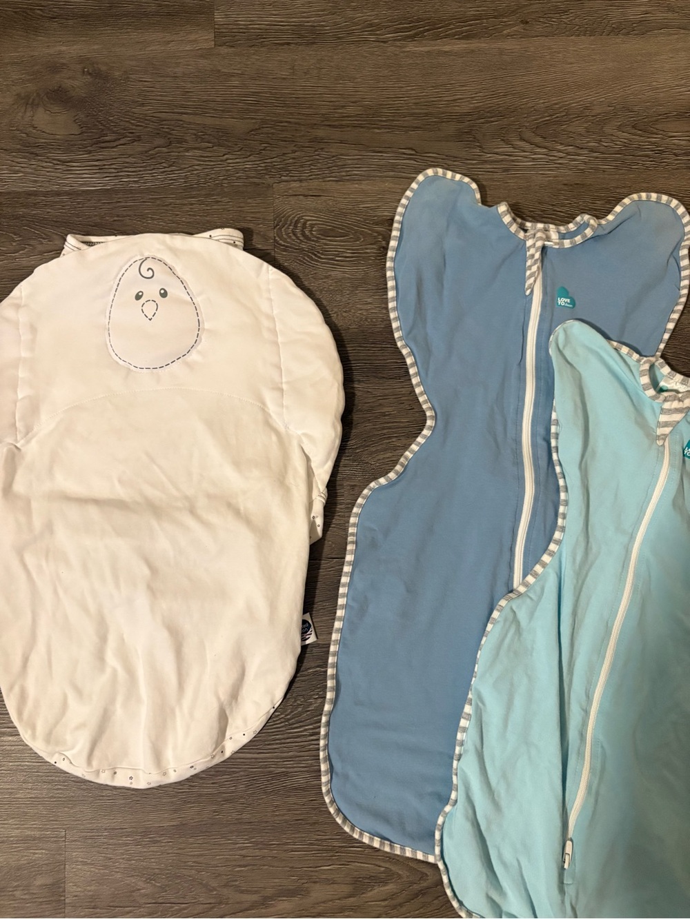 Nested Bean White, Light Blue and Blue Baby Sleep Sacks love to dream arms up